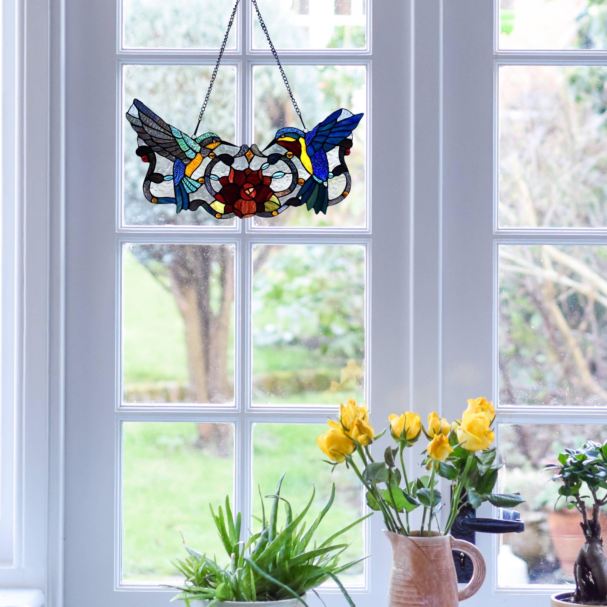 Hummingbird Stained Glass Hanging - A beautiful stained glass artwork featuring graceful hummingbirds in flight